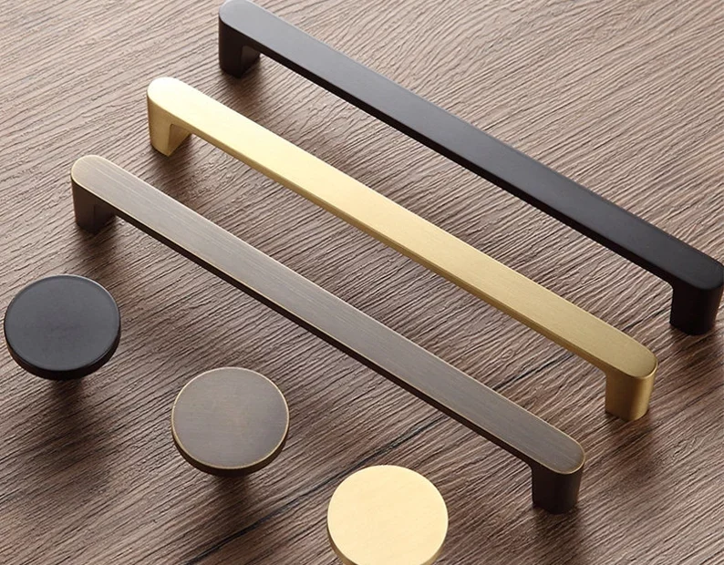 3 cabinet handles and 3 cabinet knobs in different metal colours