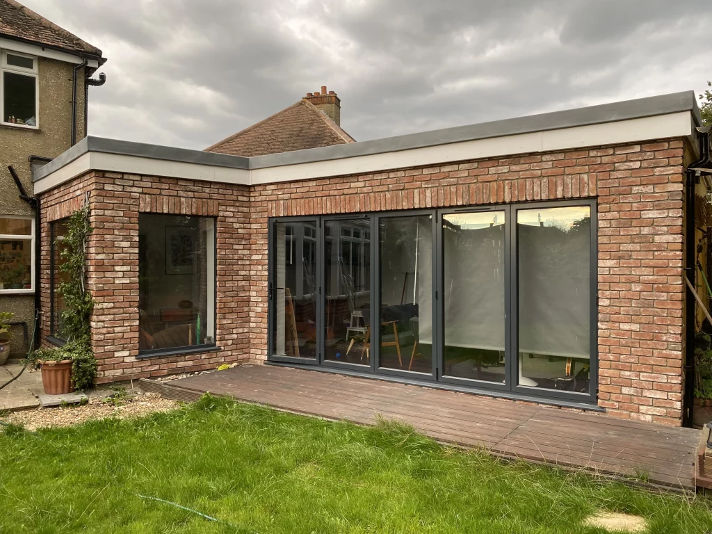 Extension with bifold doors decorated with brick slips