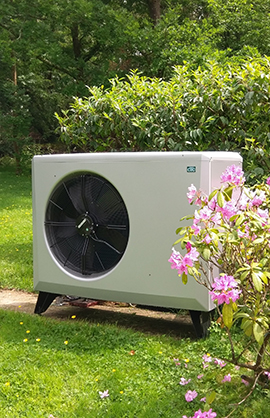 white air source heat pump in garden
