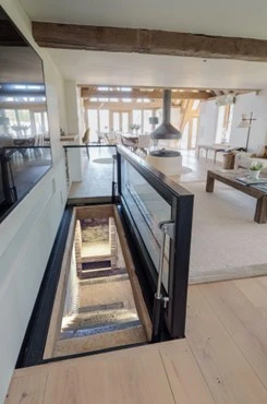 A glass floor, inviting you to explore the basement.