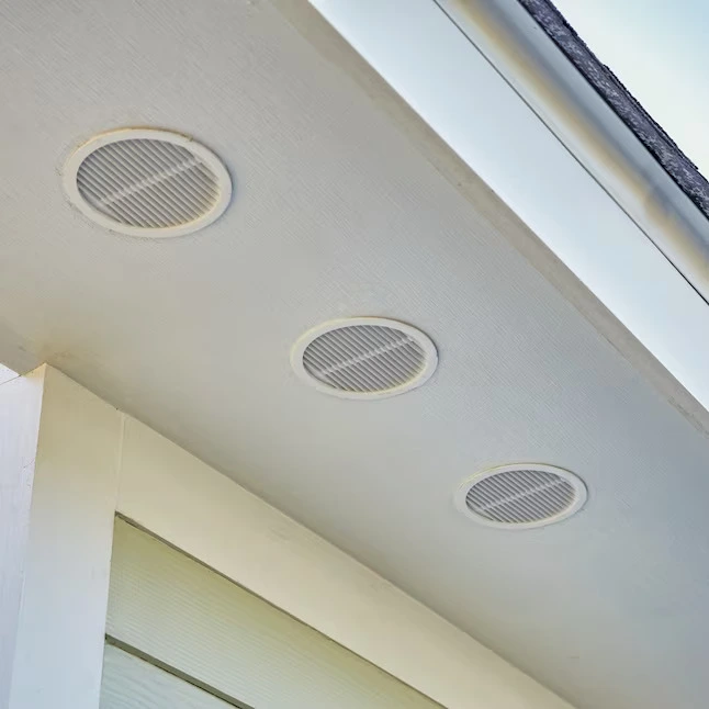 Round Soffit vents fitted to underneath of soffit on house roof