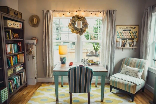 cottagecore style living room. Beige table lamp on table with pastel colour stripey chairs