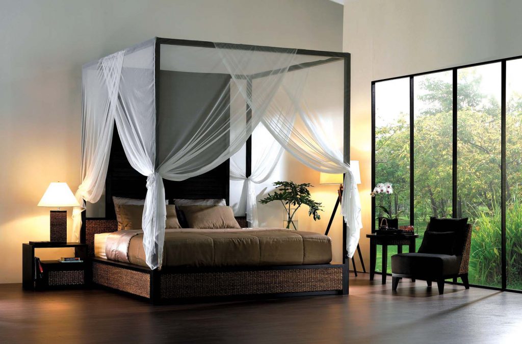 canopy bed with large bifolding door in bedroom