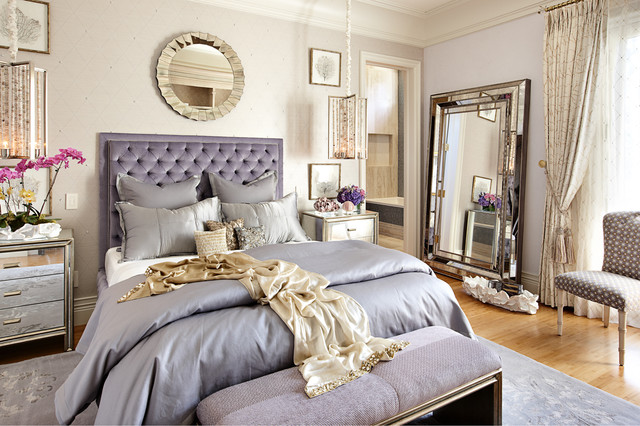 Romantic boudoir bedroom with pink and purple bedding with hints of gold
