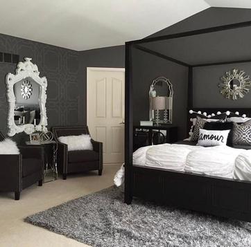 gothic interior designed bedroom. With black bed and walls with white mirror and bedding