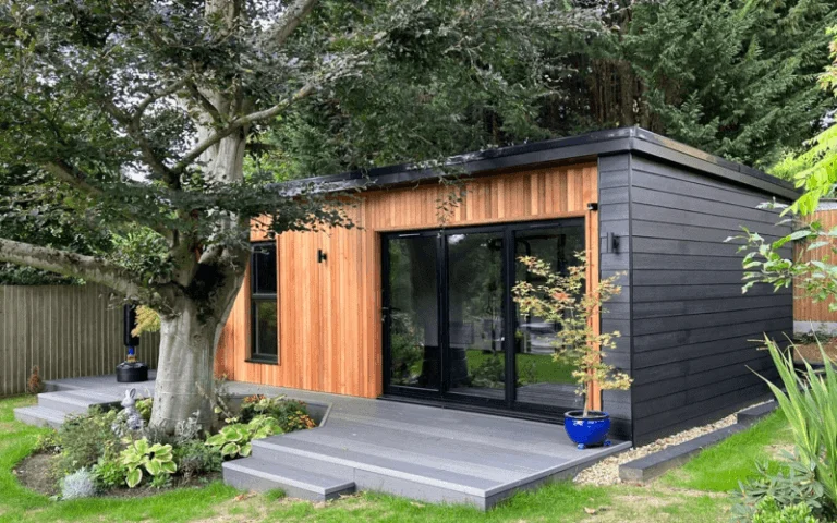 Insulated garden room with wooden cladding