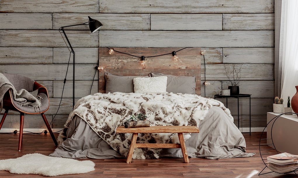 rustic bedroom theme. Wooden cladded wall with wood furniture. 