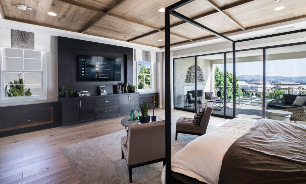 technology inspired bedroom with smart feel. Simple layout with media wall